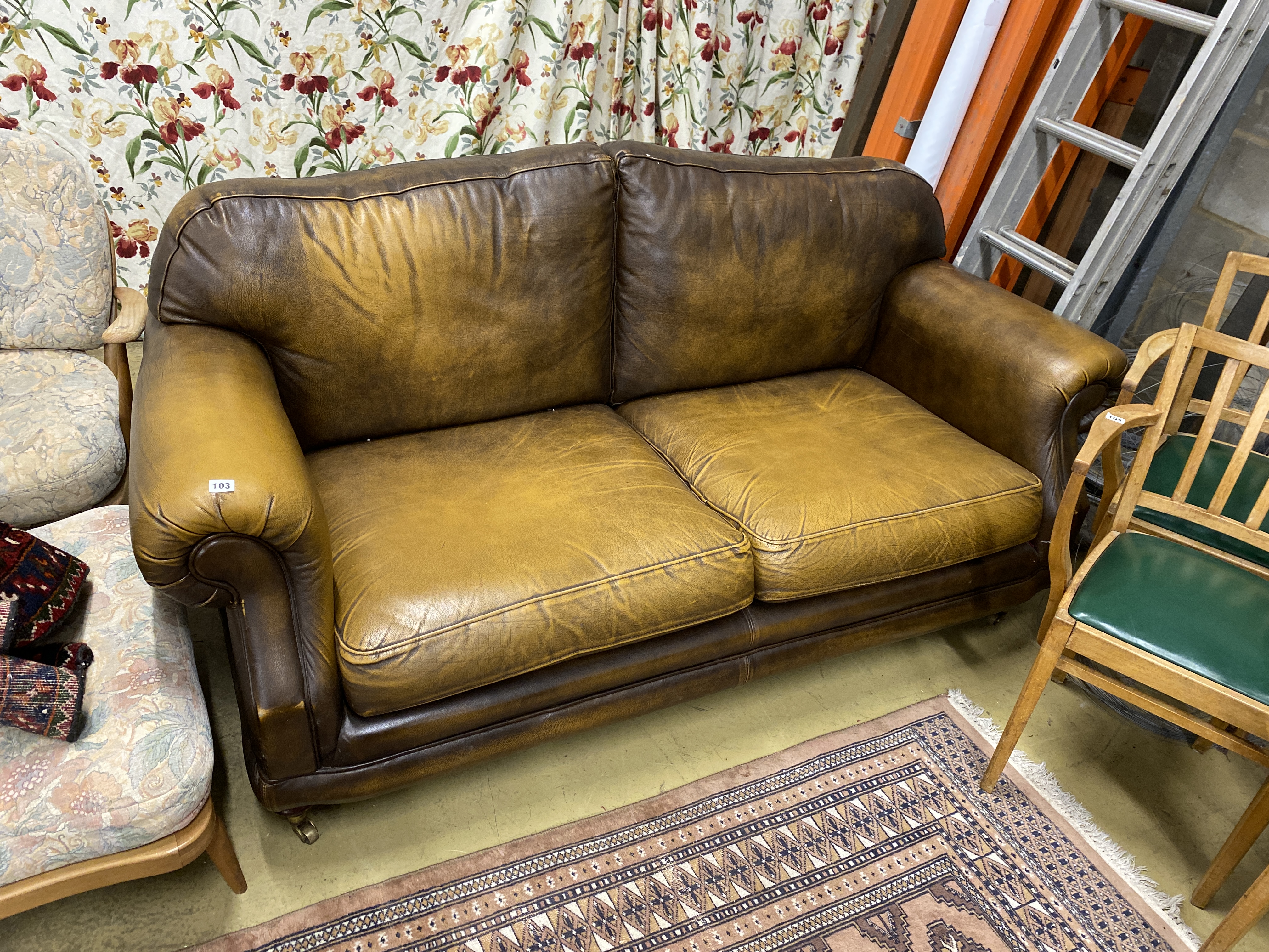 A Thomas Lloyd tan leather two seater sofa, length 190cm, depth 95cm, height 86cm